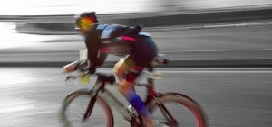 blurry triathlete racing