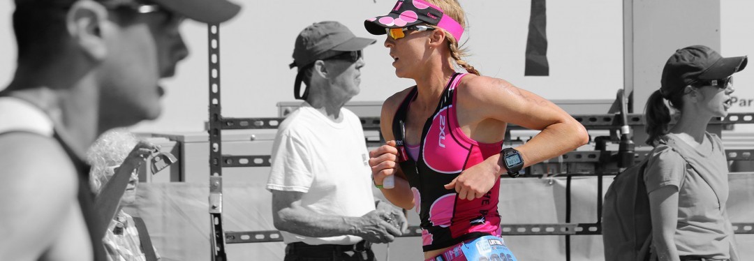 Krista Schultz running to triathlon finish line