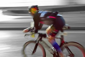 blurry triathlete riding