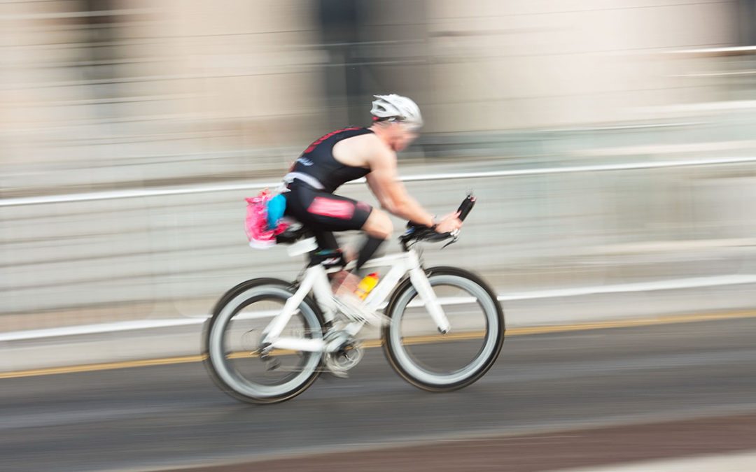 blurry triathlete on triathlon bike